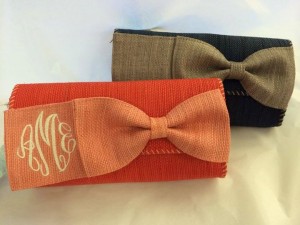 monogram clutch in coral and navy
