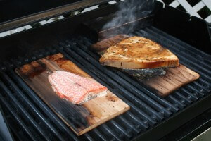 salmon grilling on cedar plank