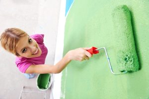 woman painting the house